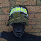 METALLICA - Splatter (Glow in the Dark) Logo - GREEN CAMO TRUCKER CAP